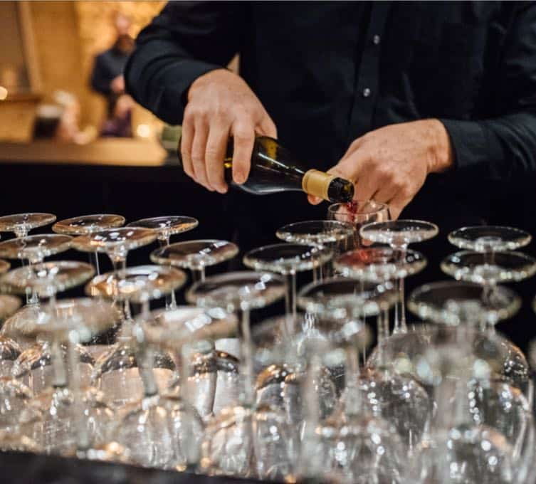 Complete Your Event-bartender pouring drinks-v2