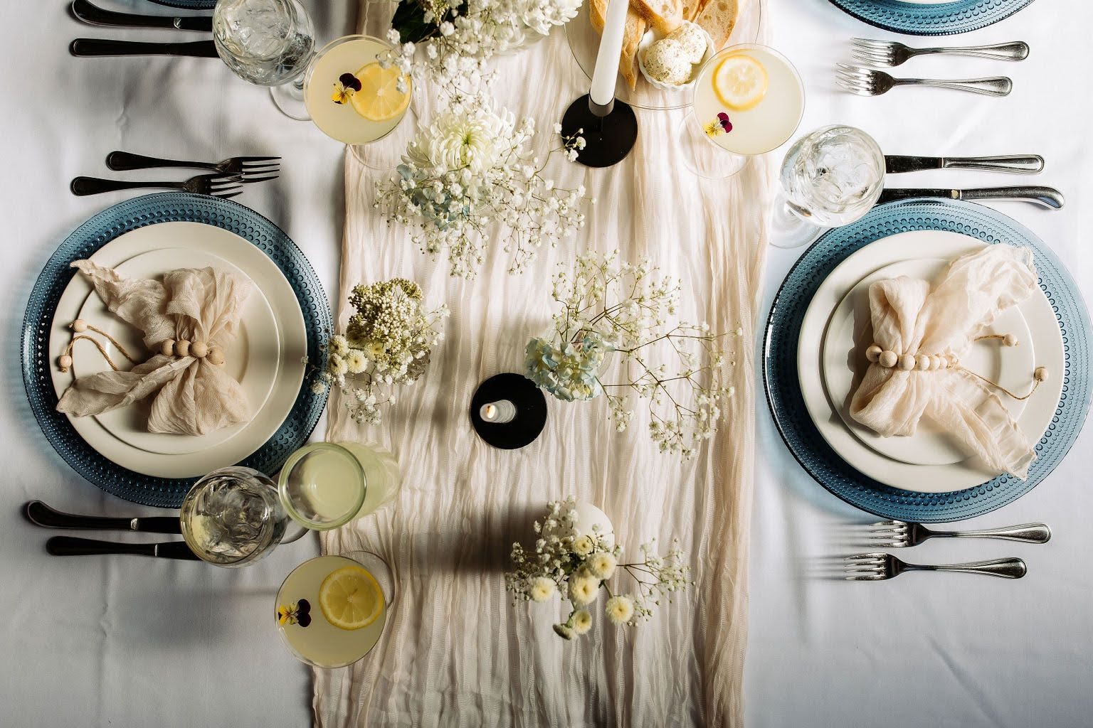 Two plate settings on a table